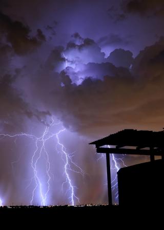 barn with storm and lightning in the background (iStockphoto:10629024 (C) SunDevilStorming)