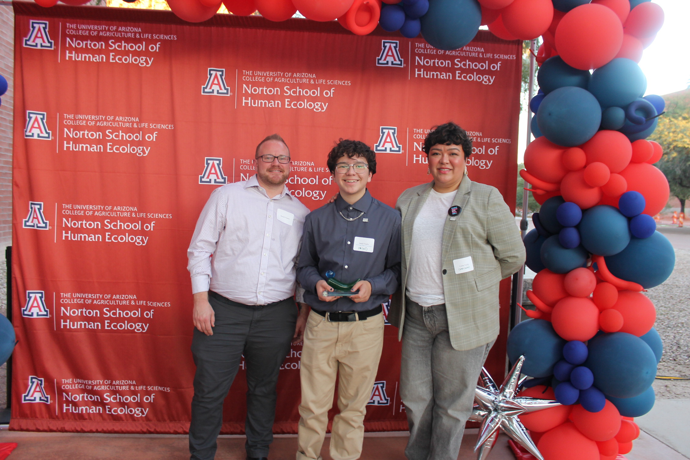 Daniel Trujillo, his mother, and Russ Toomey