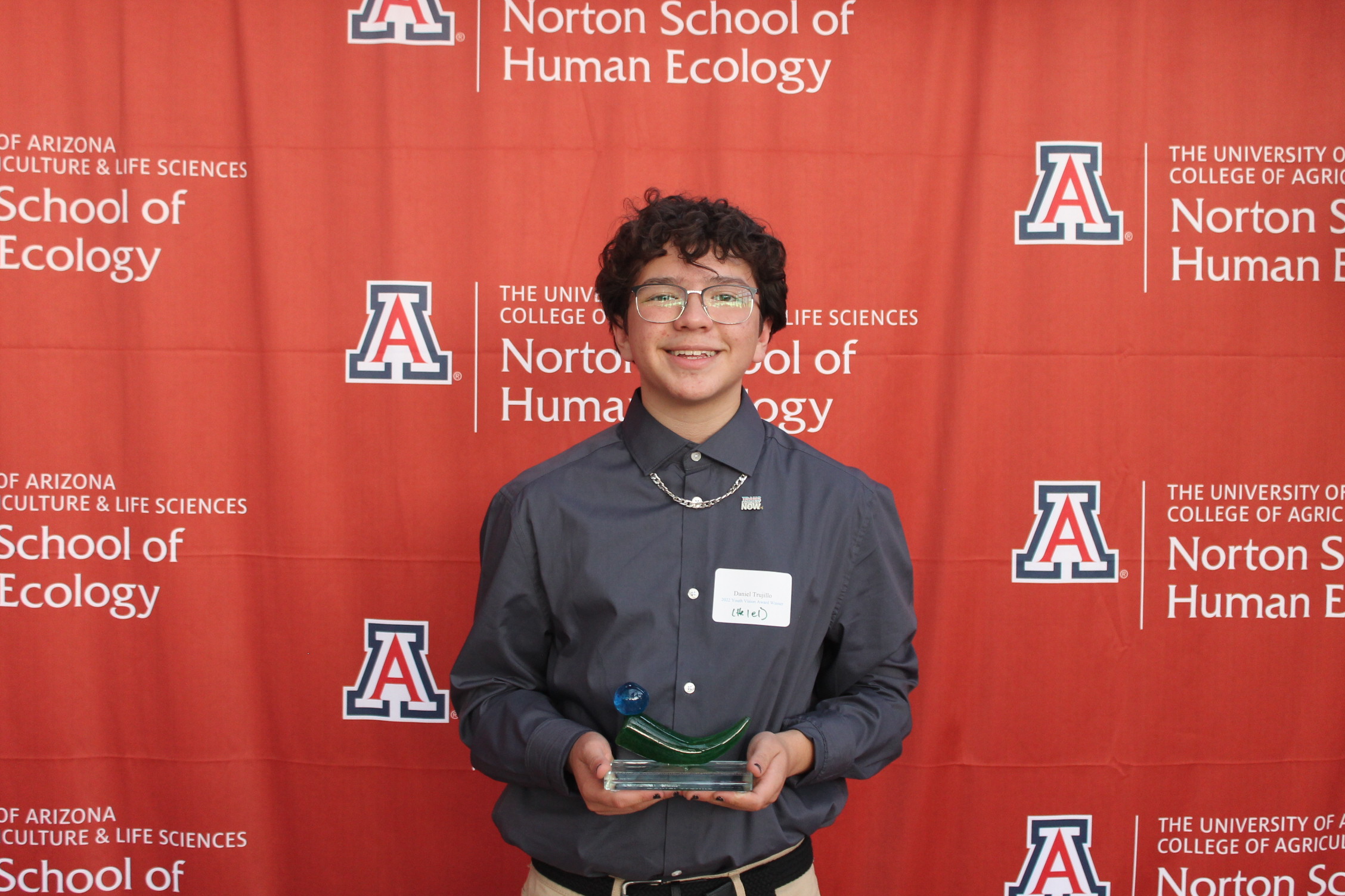 Daniel Trujillo holds his award