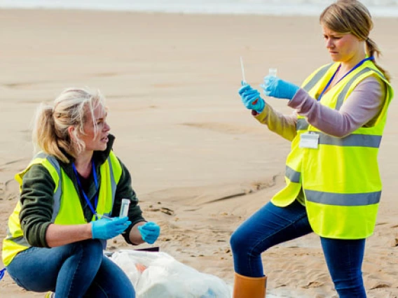 students collecting a water sample