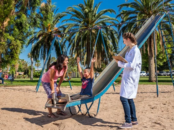 student observing a family at the park