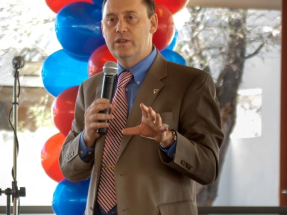 Dr. Burgess welcomes guests to the 2013 dedication festivities