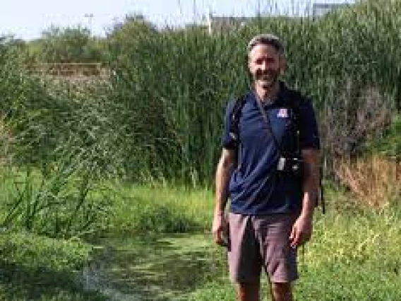 Michael Bogan stands in the historic reach of the Santa Cruz River north of downtown Tucson