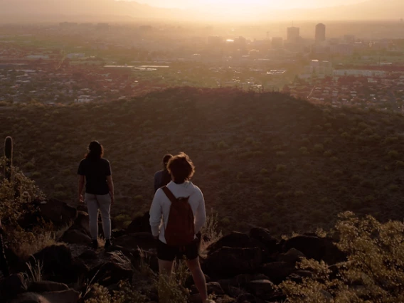 Students watch the sunset of Tucson