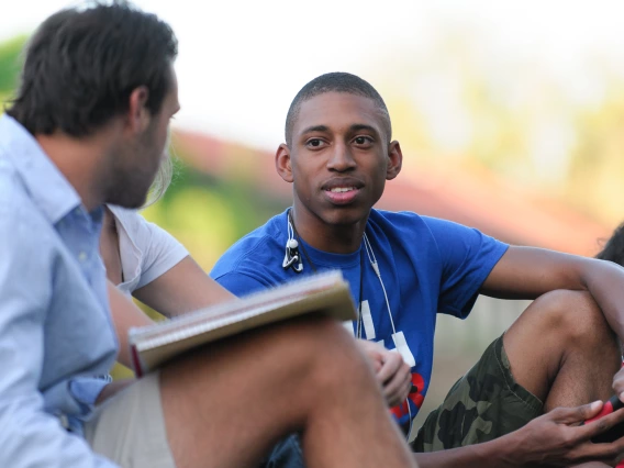 Students sitting on the University of Arizona Mall.