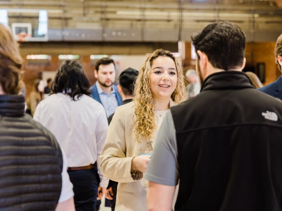 Students networking at an event.