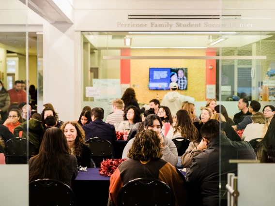 Students at an event in the Forbes building.