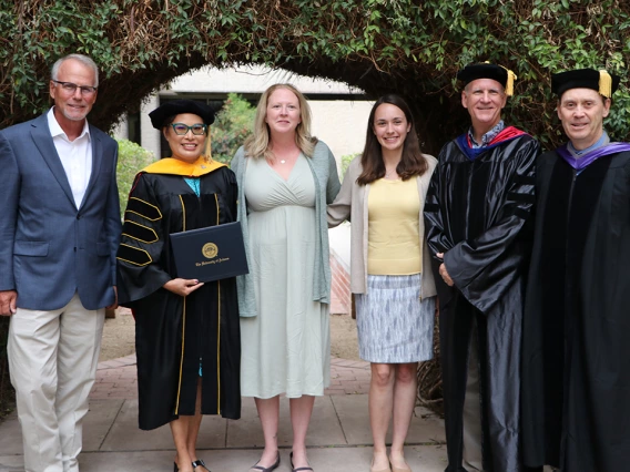 Barbara Page poses with the F3 team at the honorary degree conferment ceremony.