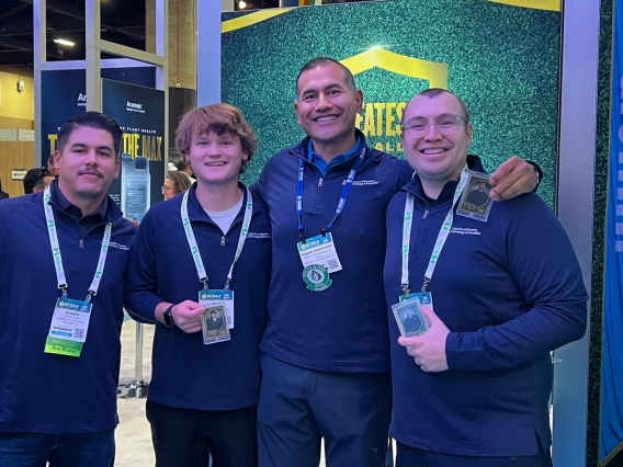 3 students from the university of arizona aeti program and frank santiago posing for a photo at the turf bowl