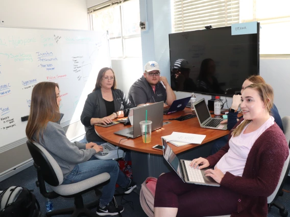 Students meeting in a classroom.