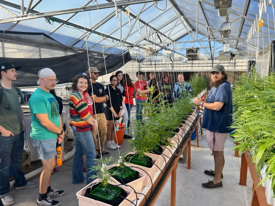 Students working in a greenhouse.