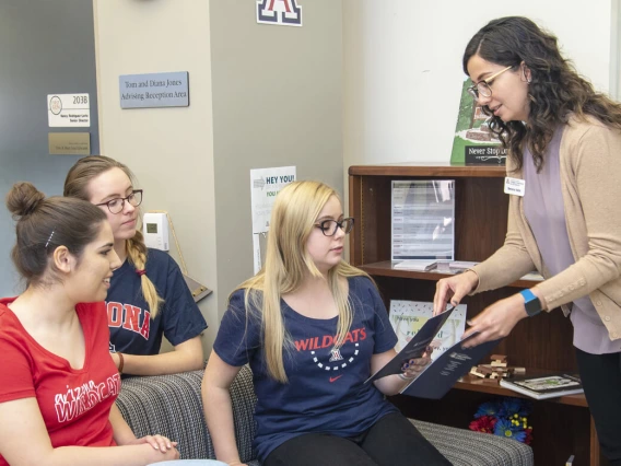 Advisor working with students.