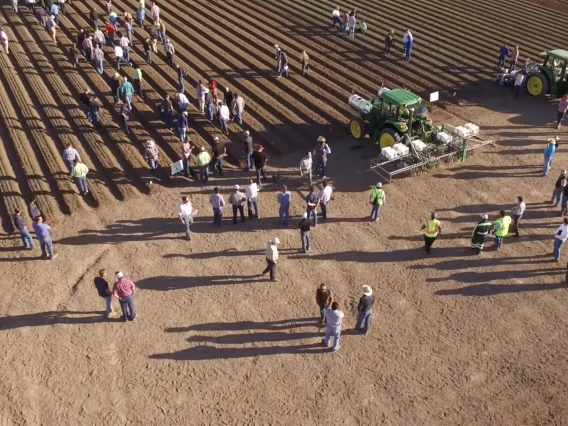 Picture of agricultural field demonstration with machinery