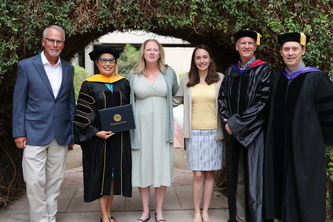 Barbara Page poses with the F3 team at the honorary degree conferment ceremony.