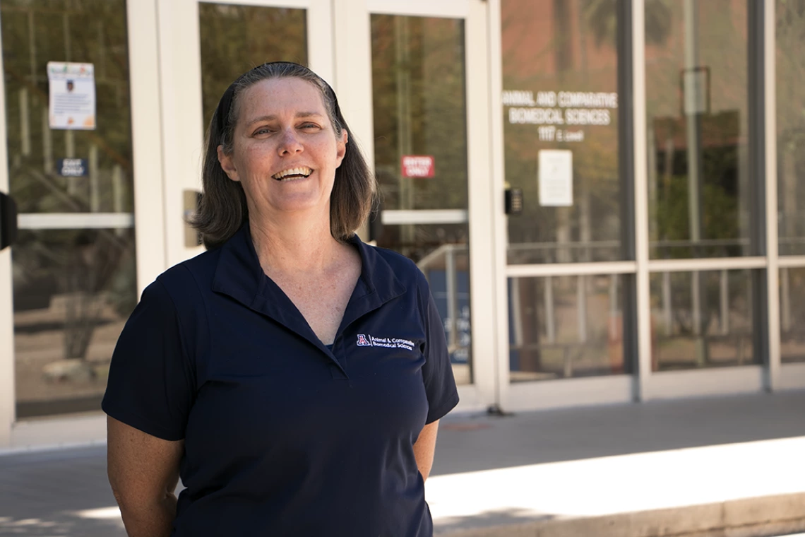 Fiona McCarthy poses in front of the School of Animal & Comparative Biomedical Sciences on the UA's main campus.