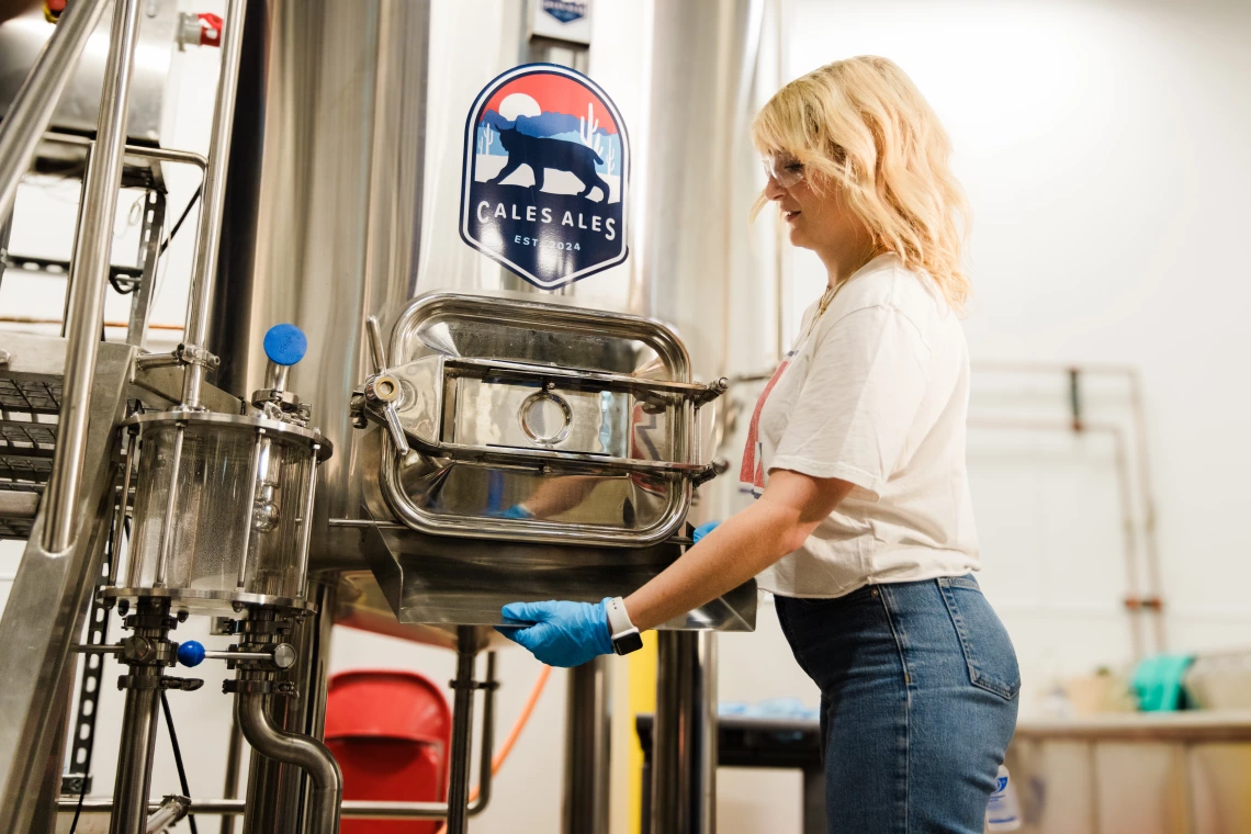 Fermentation science student Gracie Walters works in the CALES Ales brewhouse at Cork & Craft.