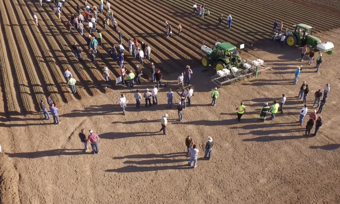 Picture of agricultural field demonstration with machinery