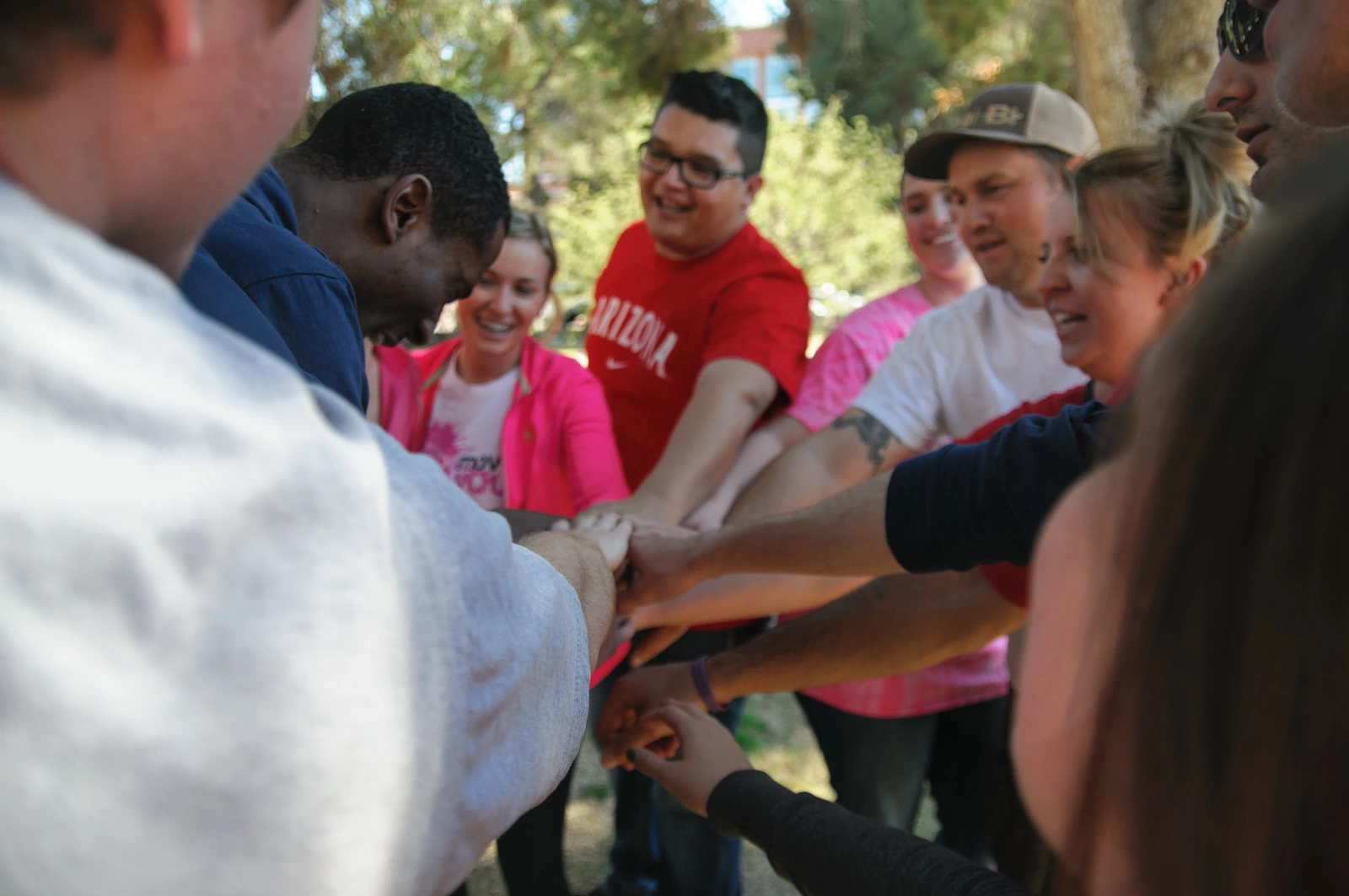 Students in a team huddle.