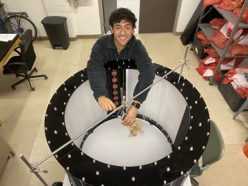 Undergraduate student Ruben Pena works on a plant root imaging device in Alexander Bucksch's lab at UArizona