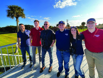 A group of RTIP students pose with Todd Pletcher.