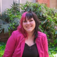 Jo Mikronis outside the Saguaro Building on UA main campus