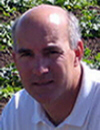 John Palumbo on the foreground, with a lettuce field as the backdrop. Warning: this image is contained inside of a frame do not bookmark!